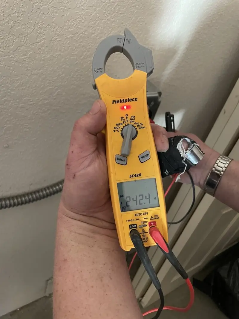 Voltage testing with clamp meter during Outlet Installation in Westlake Village